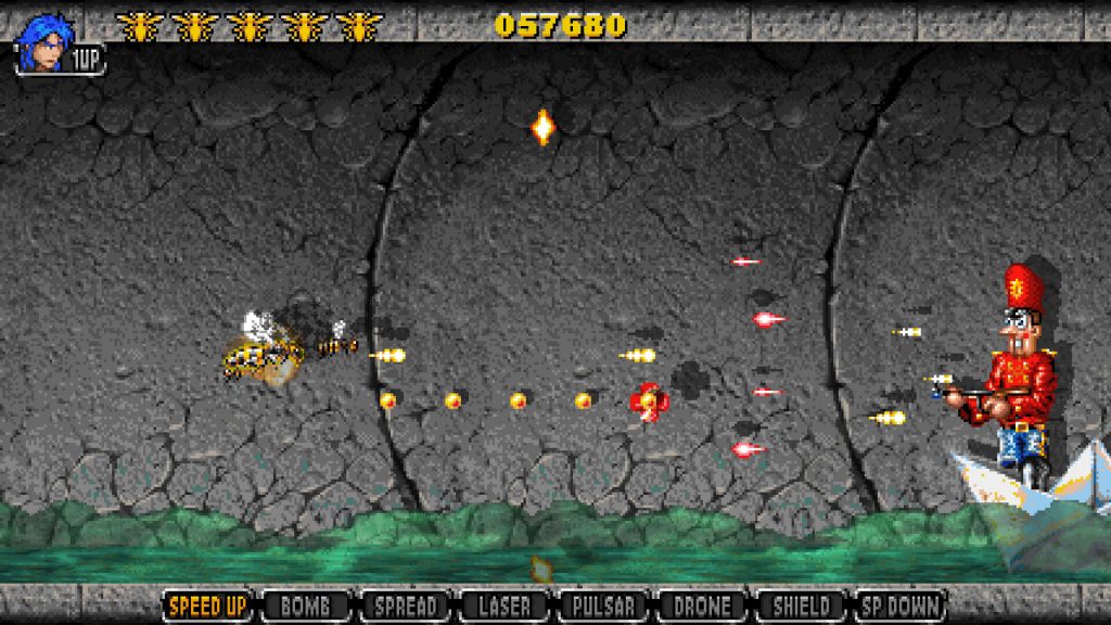 Apidya' Special sewer boss fight showing the bee battling a giant nutcracker soldier boss firing red laser beams in a dark industrial setting
