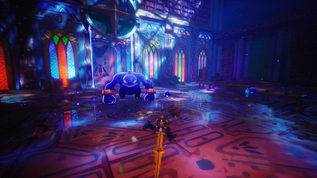 Zirian slides into combat against a massive blue enemy inside a cathedral-like hall with stained glass windows