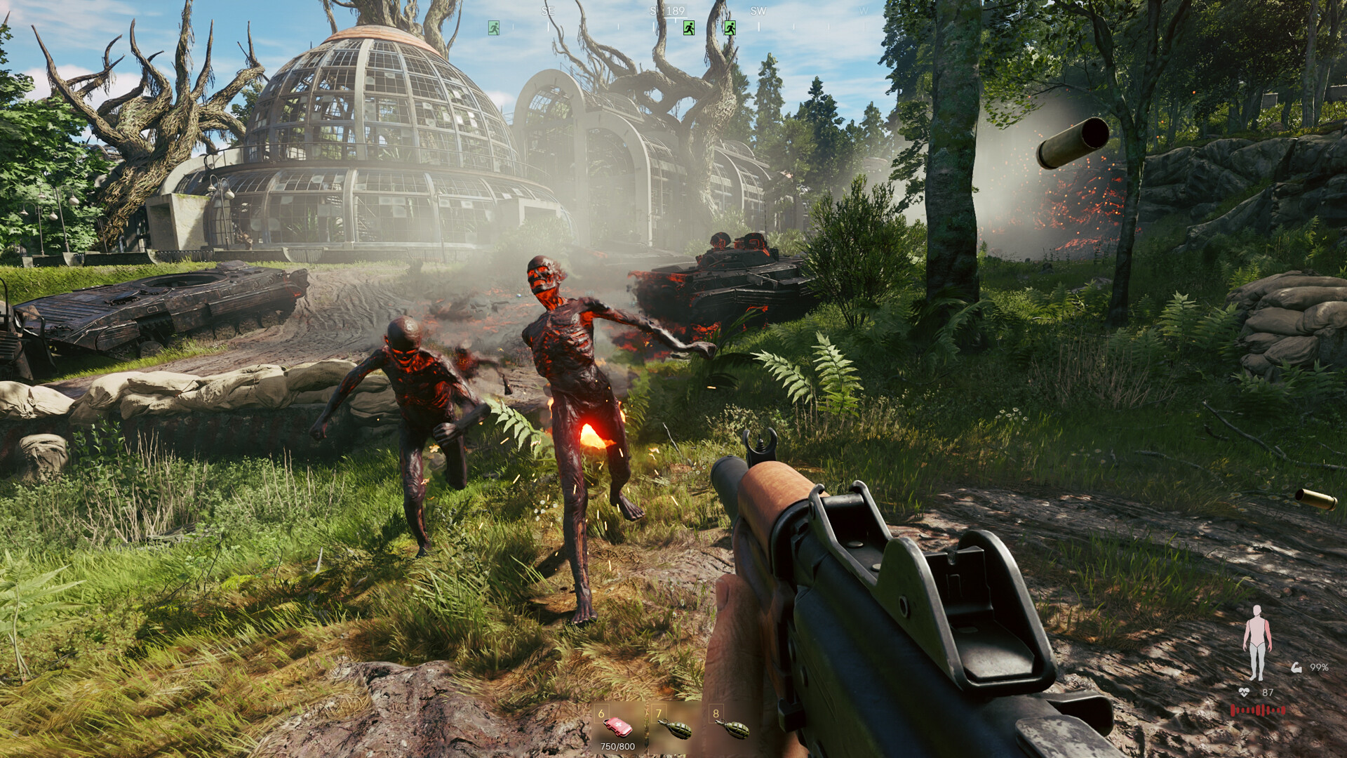 Player engaging zombie-like creatures in a grassy field with ruined buildings and tanks in the background