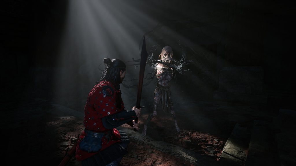 A character in red armor faces a monstrous humanoid in a dark dungeon area
